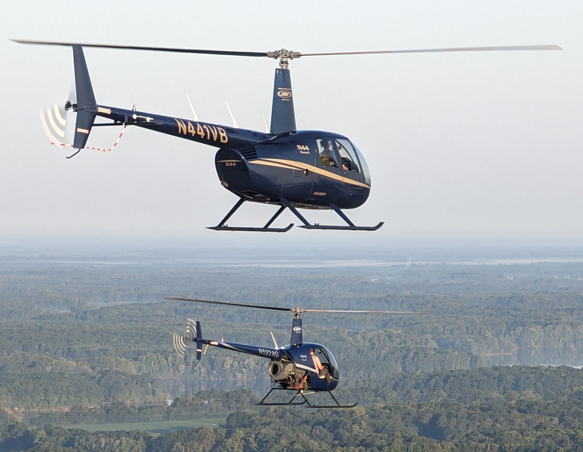 Two Helicopters flying on top of one another
